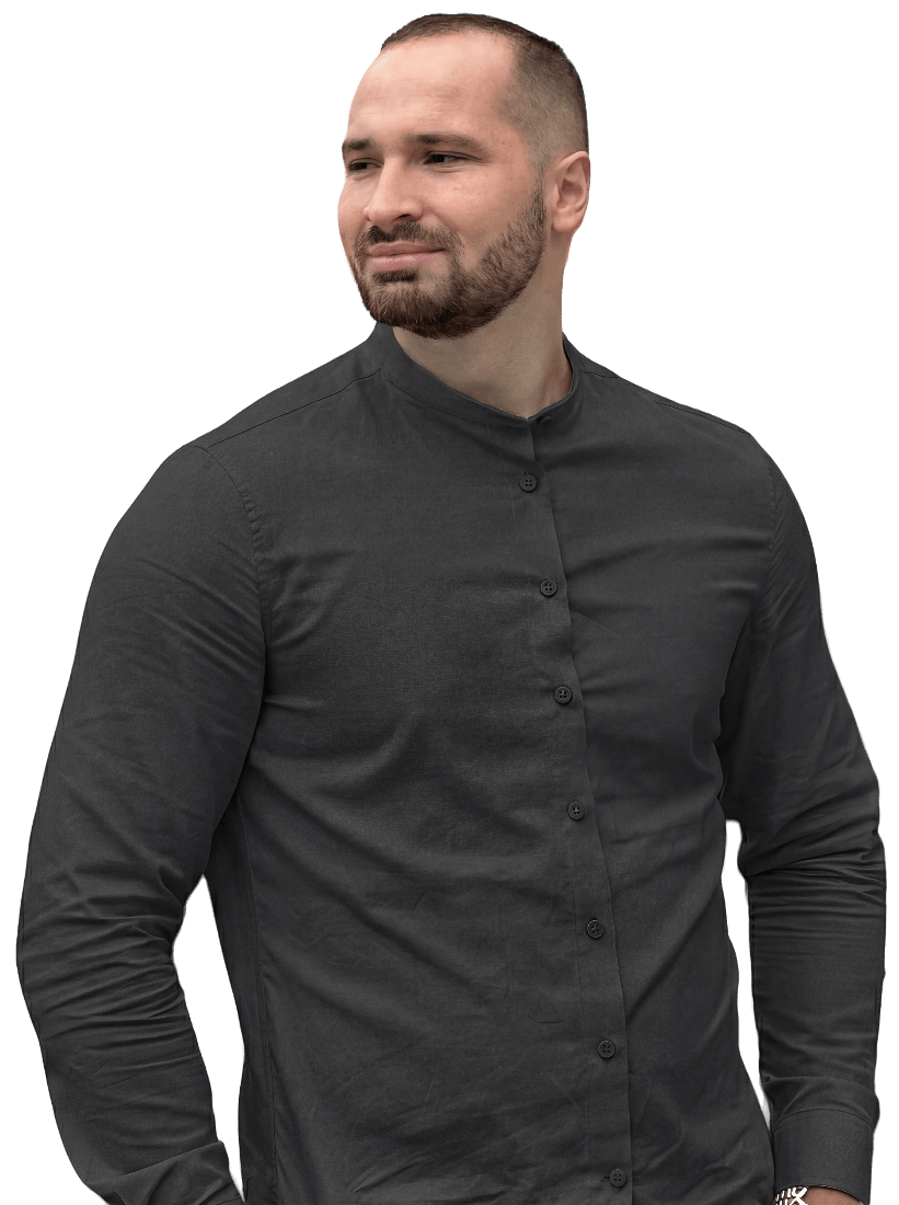 Bearded man wearing a black button-up mandarin collar shirt looking to his right.